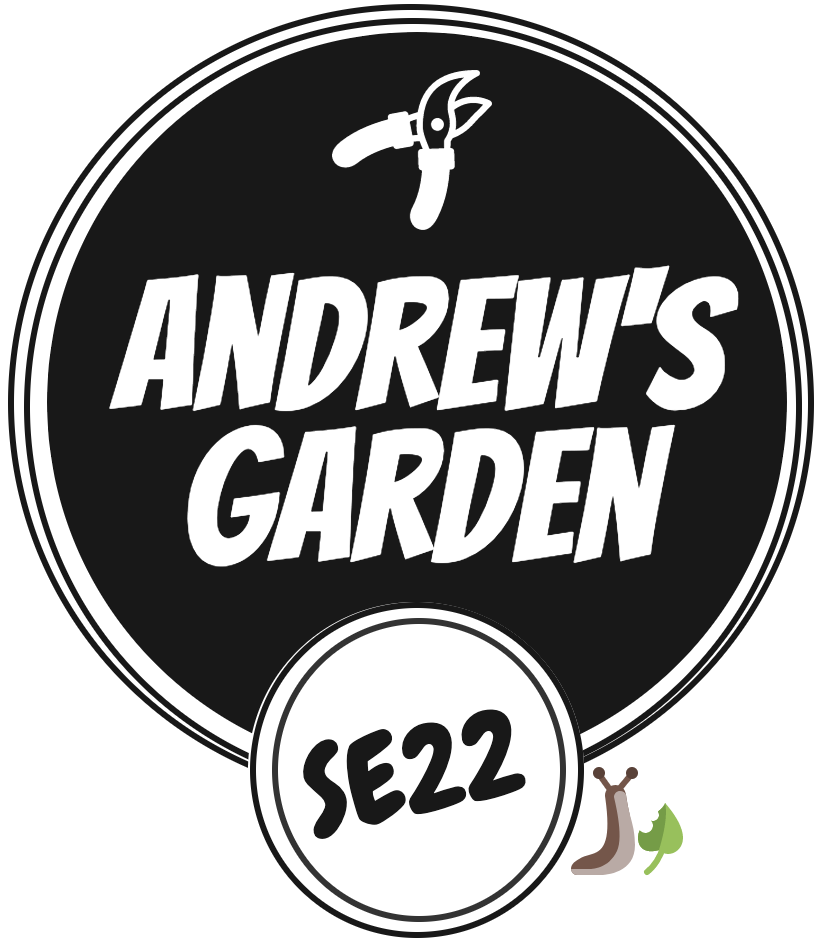 Andrew's Garden Logo over grass section of the garden